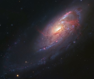 M106 Spiral Galaxy as imaged using the Hubble Telescope. Image available at hubblesite.org